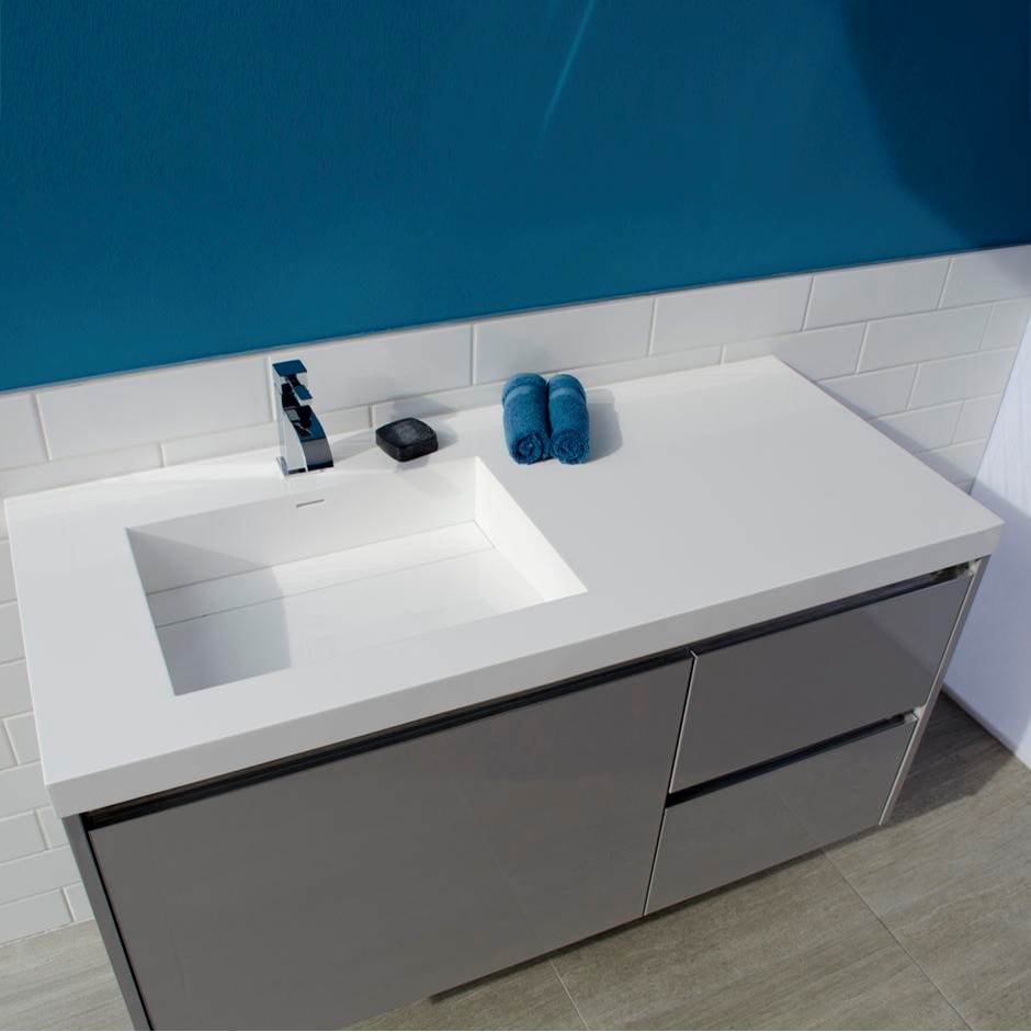 Lacava Vanity-top Bathroom Sink made of solid surface, with an overflow and decorative drain cover.